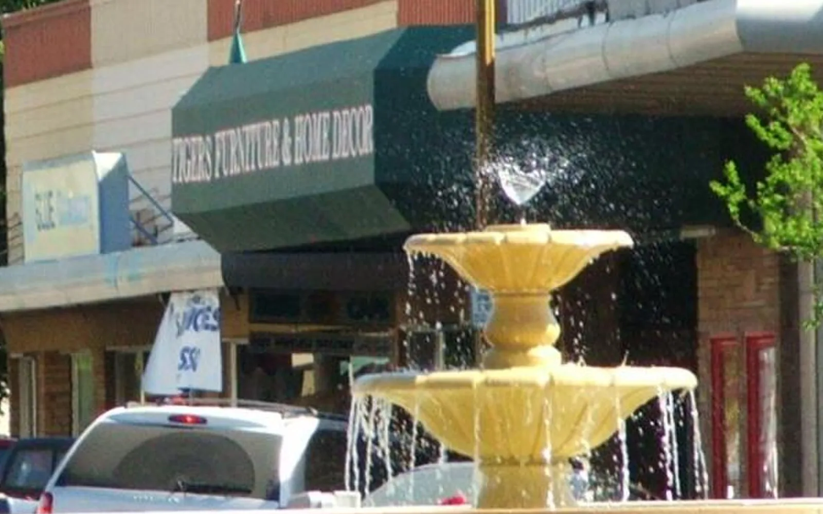 Fountain and storefronts in central Patterson.